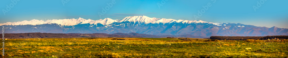 Panorama of Fagaras mountain range from sibiu, Romania. Fall mountains with snow covered mountain peaks.