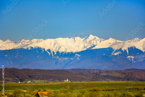 Fagaras mountain range in Romania. Autumn landscape with snow covered mountains.