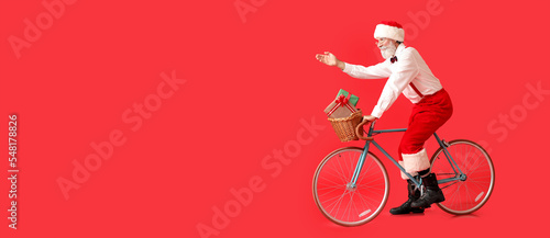 Santa Claus riding bicycle ...