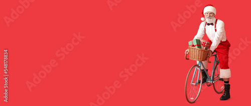 Santa Claus riding bicycle ...