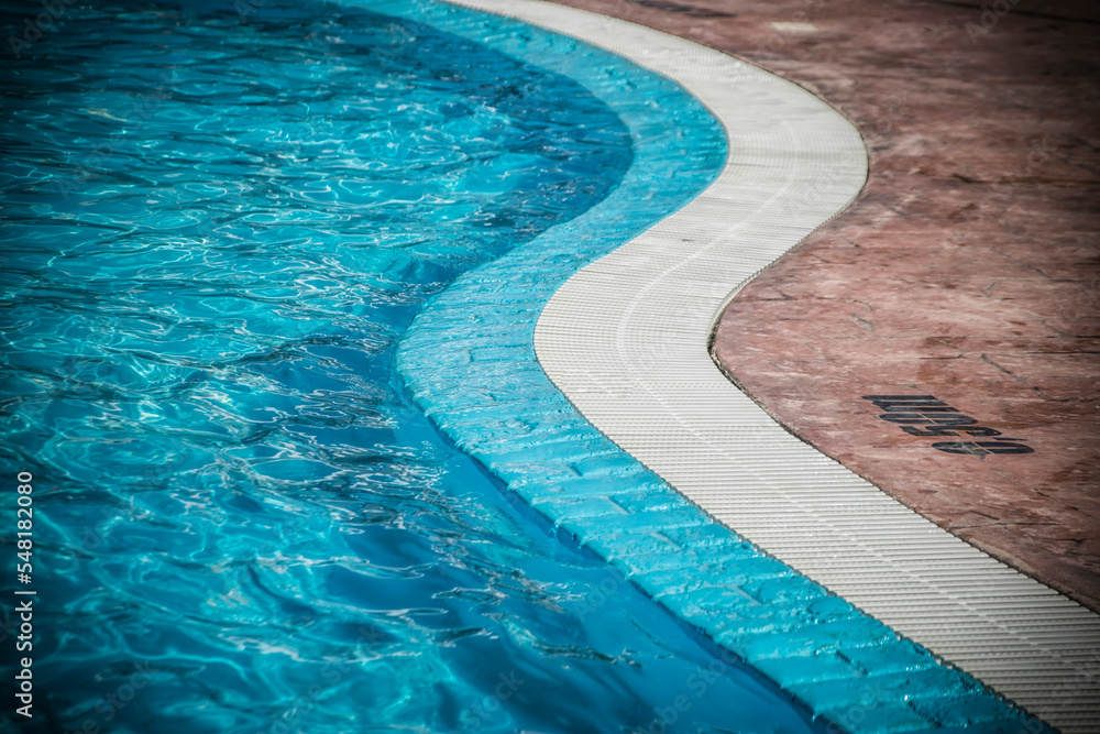 Edge of a swimming pool with depth markings