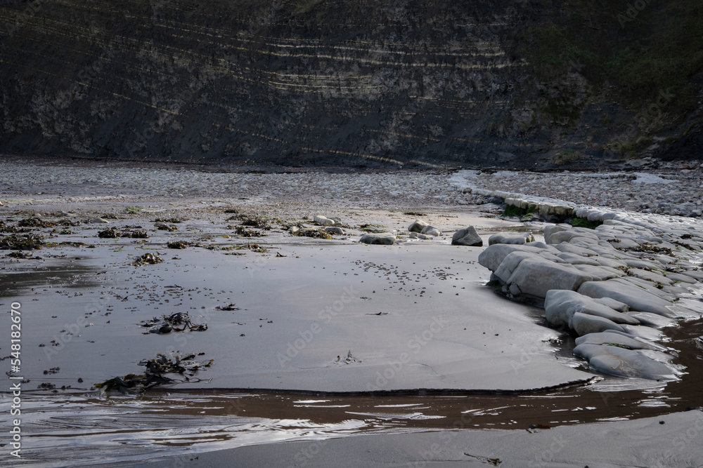 Rock formations on a British beach showing changing coastline and erosion Rock formations on a British beach showing changing coastline and erosion