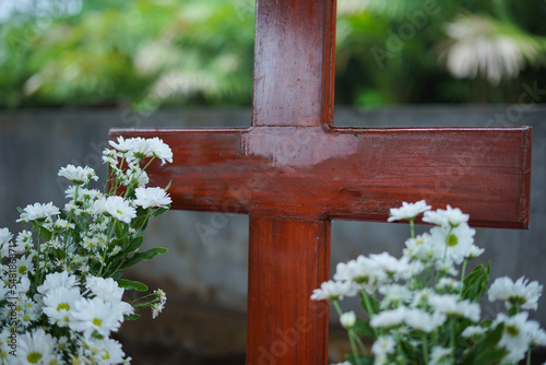 new tomb with fresh flowers. Selective focus photos photo