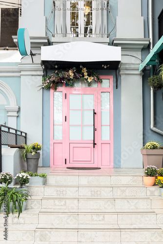 View on entrance of building with pink door