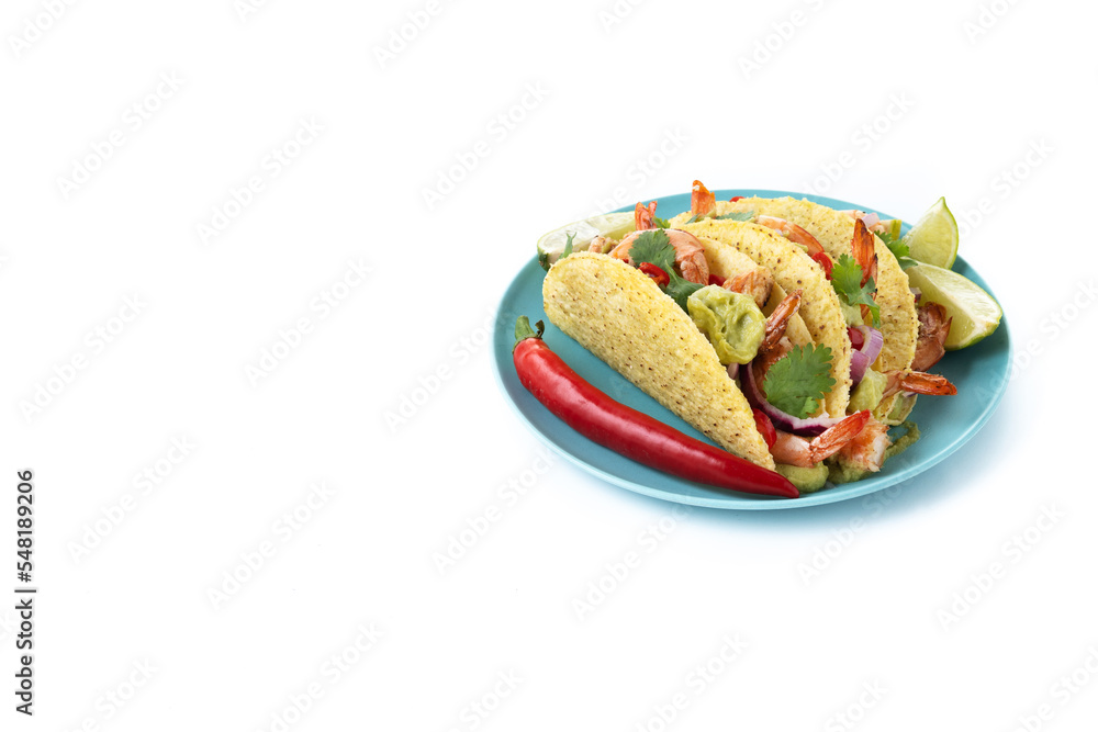 Mexican tacos with shrimp,guacamole and vegetables isolated on white background. Copy space