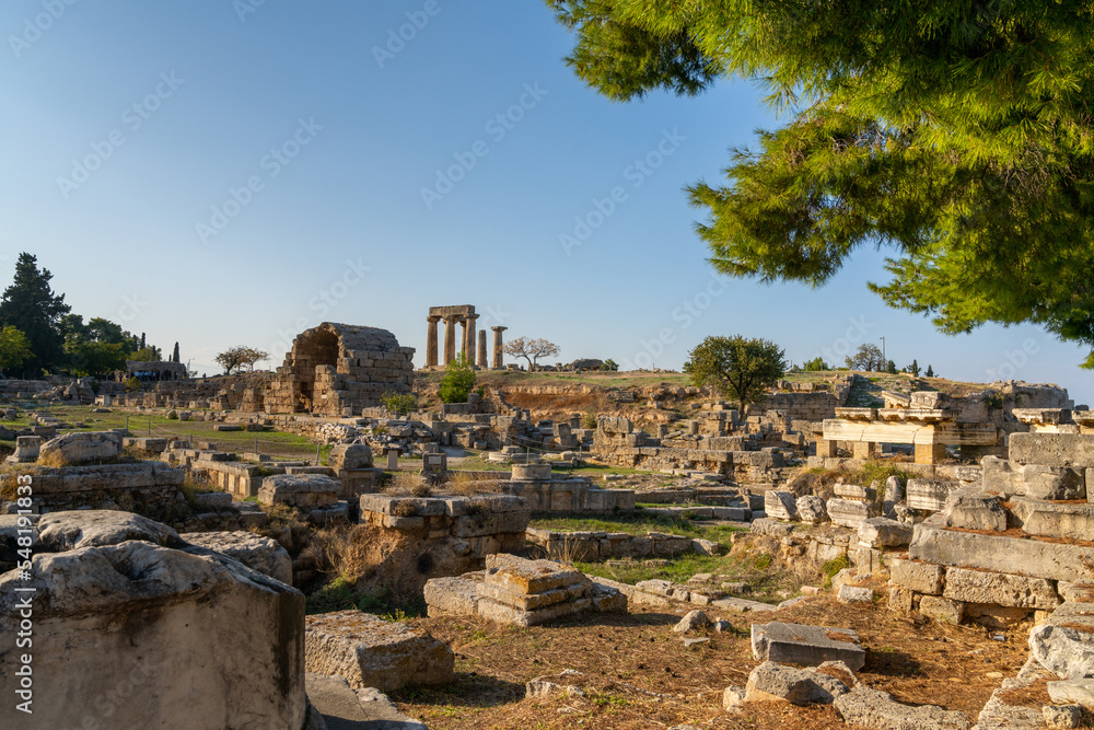 view of the ruins of Ancient Corinth in southern Greece with the Temple of Apollo in the background