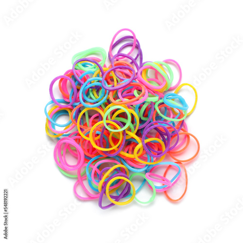 Heap of office colorful rubber bands isolated on white background