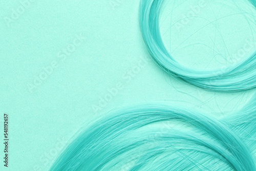 Aqua blue hair strands on m...