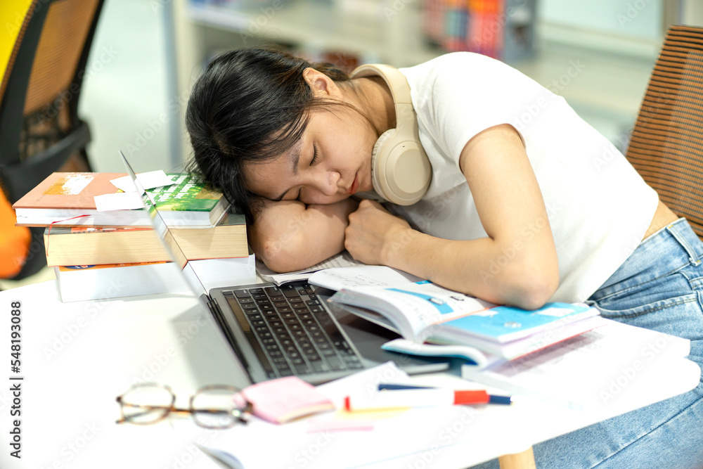 beautiful asian girl tired in the library beautiful asian girl tired in the library