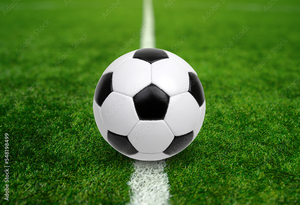 Soccer ball on stadium field texture Soccer ball on stadium field texture