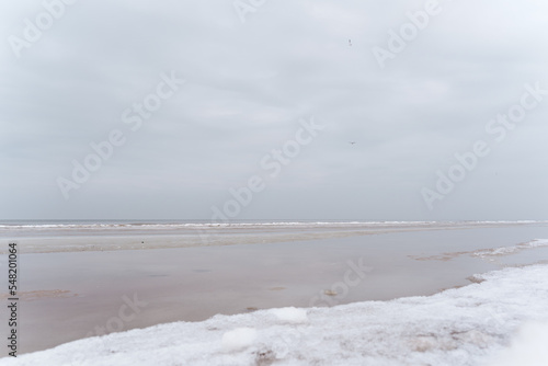 Baltic Sea coast on a winter cloudy day in Jurmala, Latvia