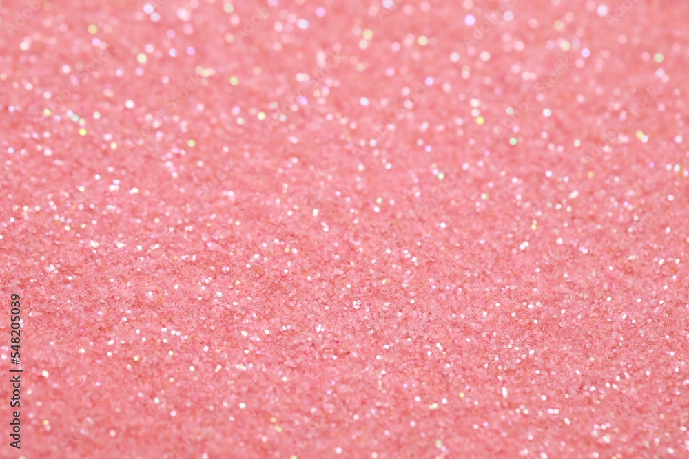 Beautiful pink shiny glitter as background, closeup