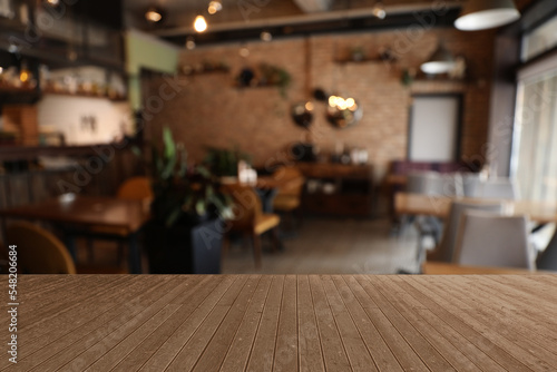 Empty wooden surface in cafe. Space for design