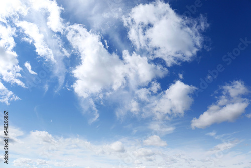Picturesque blue sky with white clouds on sunny day