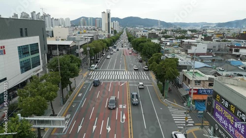 Horizon view of road traffics with mountain range on the day, in Daegu city, South Korea. photo