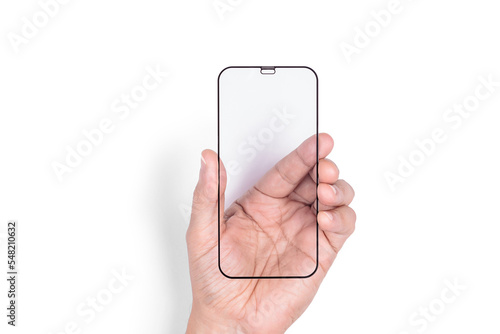 The hand holds a protective screen for a mobile phone. White background. Close-up.