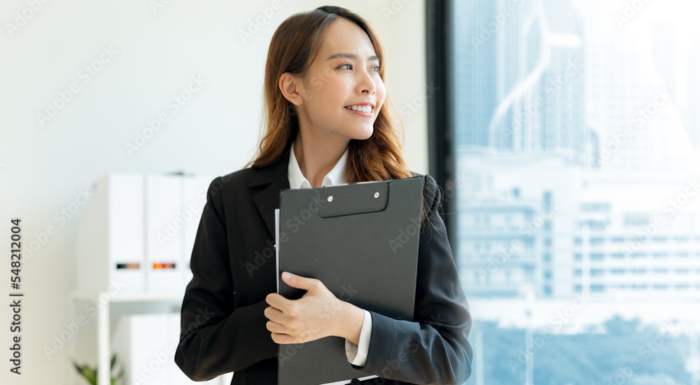 Business woman holding files Inside the modern office. Business woman holding files Inside the modern office.