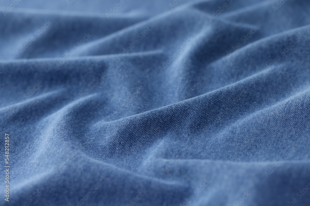 Obraz premium Light blue jeans fabric cloth texture background