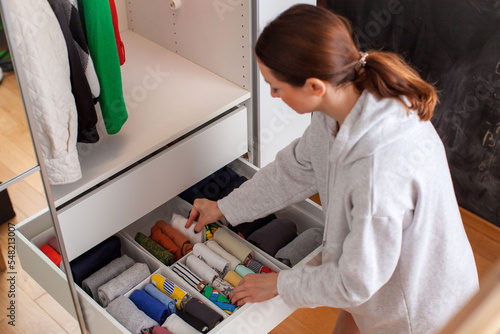 Vertical storage of clothing. Clothing folded for vertical storage in the linen drawer. Nursery. Room interior. Marie Kondo system. 