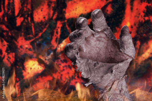 Принти на полотні Zombie hand with peeling skin on a dark fiery background