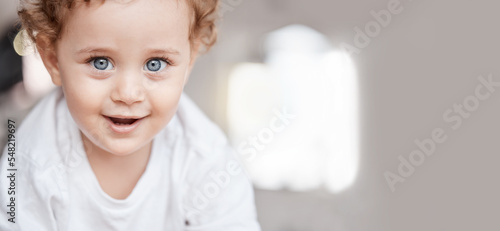 Family  portrait and face of baby boy learning to crawl on living room floor with cute  adorable and sweet smile. Love  relax and young kid smiling in family home for child care  wellness and health