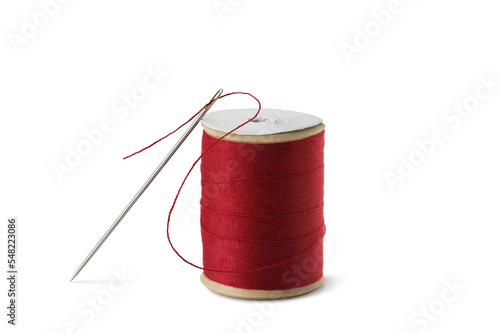 Sewing needle with red spool and tape measure