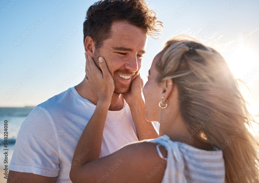 Woman, man and touch face, love and happy together at the beach, travel and romance outdoor for bonding. Couple on adventure by the ocean, embrace with lens flare and care while spending quality time Woman, man and touch face, love and happy together at the beach, travel and romance outdoor for bonding. Couple on adventure by the ocean, embrace with lens flare and care while spending quality time