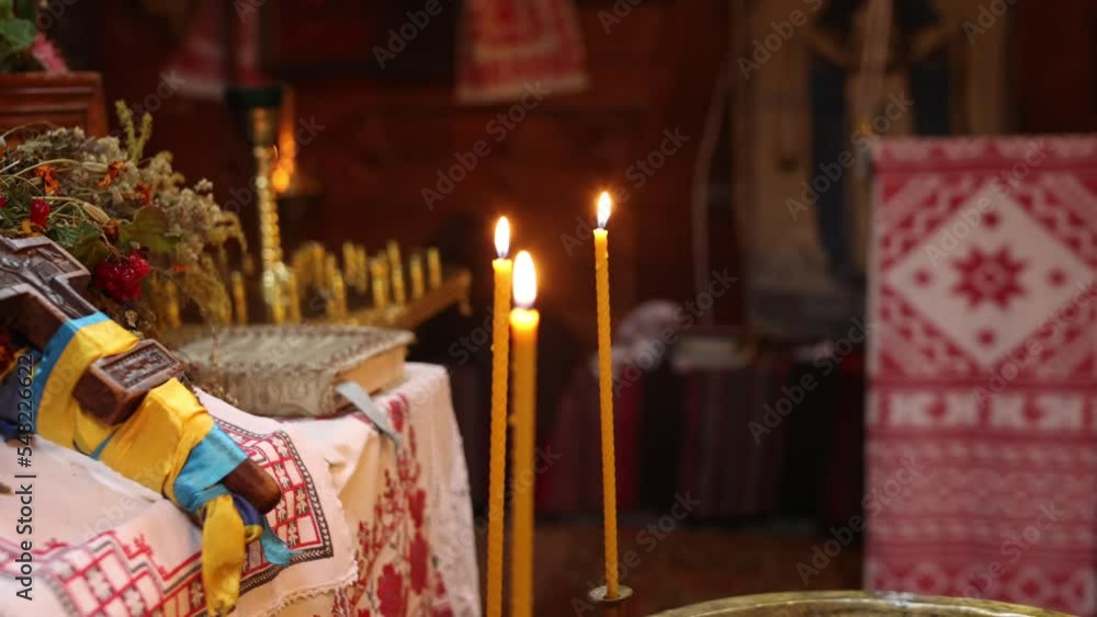 candles are burning in the church, bright yellow candles are burning in the church, bright yellow