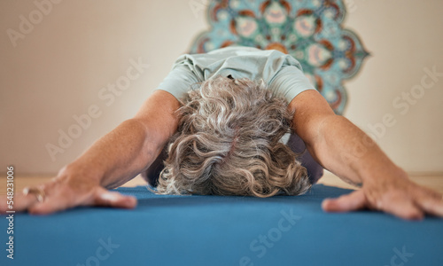 Senior woman, yoga stretching and floor in gym exercise, workout or fitness training routine. Elderly yogi, studio and balance for wellness, health or zen mindfulness for healthy spiritual mindset
