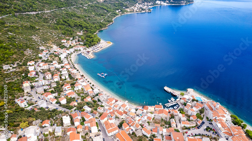 Igrane village on Makarska riviera church tower and waterfront view, Dalmatia region of Croatia