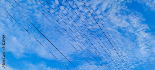 Wires with blue sky. electrical wires on a background. electric cables-Transmission Line cables. Electric wire in the sky backdrop- Electric wire isolated background