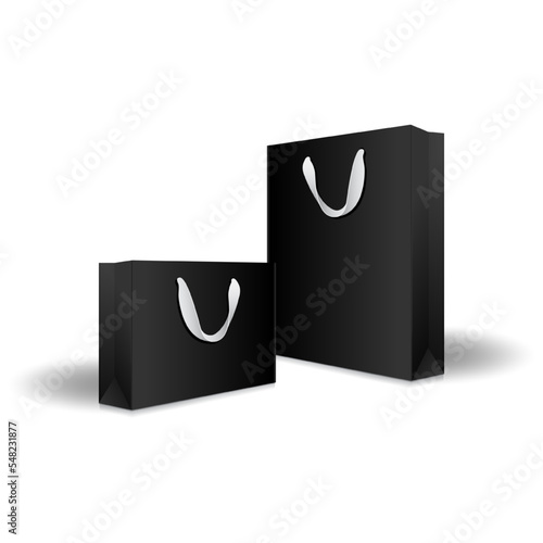 Blank black paper shopping bags or gift bags with ribbon handles mockup template. Isolated on white background with shadow. Ready to use for branding design. Realistic vector illustration.