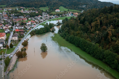 Fotografie, Tablou Extensive deluge across Europe, flooded mountain valley, near the households area and traffic ways, drone shot