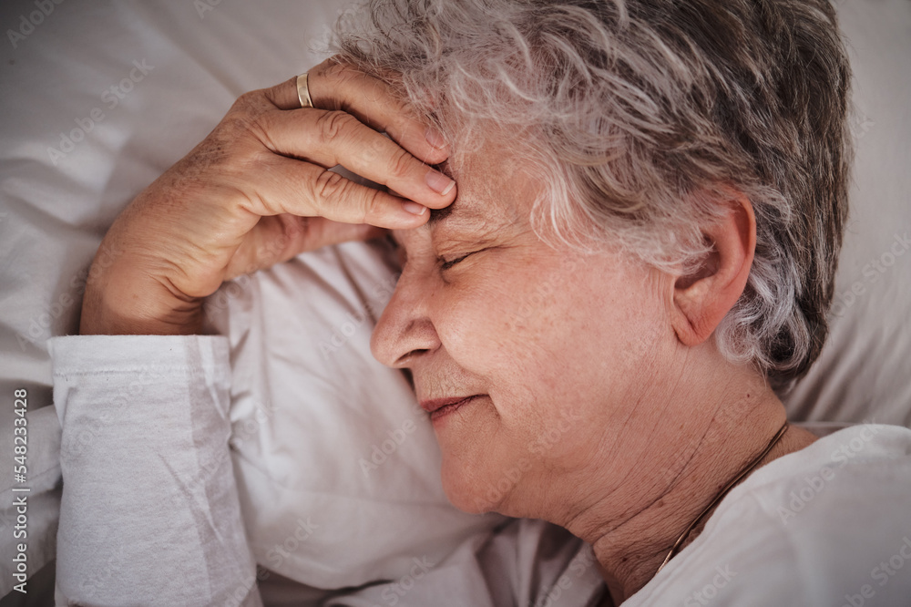 Sleep, headache and senior woman in a bed with stress, anxiety and tired. Sick, sad and face of an elderly lady dreaming with depression and sleeping in her bedroom for rest during retirement Sleep, headache and senior woman in a bed with stress, anxiety and tired. Sick, sad and face of an elderly lady dreaming with depression and sleeping in her bedroom for rest during retirement