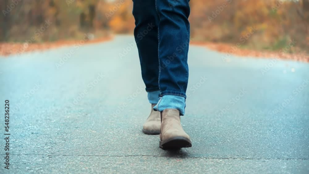 man legs in chelsea shoes. foot in leather shoes man legs in chelsea shoes. foot in leather shoes