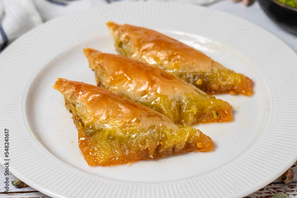 Sobiyet baklava on a white wooden background. Turkish cuisine delicacies. Turkish baklava. close up