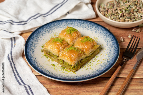 Pistachio baklava on wooden background. Turkish cuisine delicacies. Turkish baklava. close up