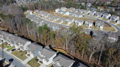 Fotografie Suburban subdivision sprawl with row of high density brand new two story houses
