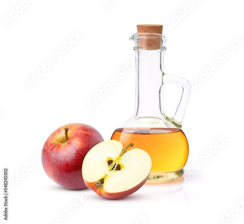Apple cider vinegar in glass decanter bottle with red apple fruit isolated on white background. photo