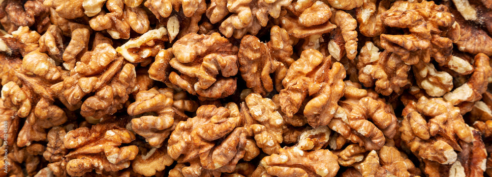 Raw Organic Walnuts background, top view. Flat lay, overhead, from above. Raw Organic Walnuts background, top view. Flat lay, overhead, from above.