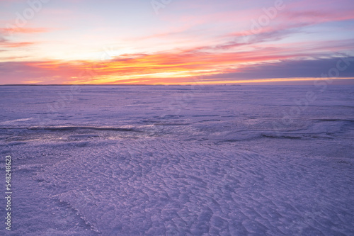 Sunset over the frozen sea. P  rken  s  Finland.