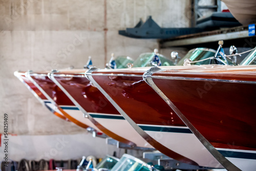 Classic wooden motor boats in shipyard photo