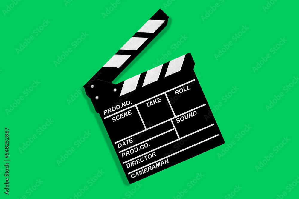 Clapperboard for shooting video footage takes on a green background