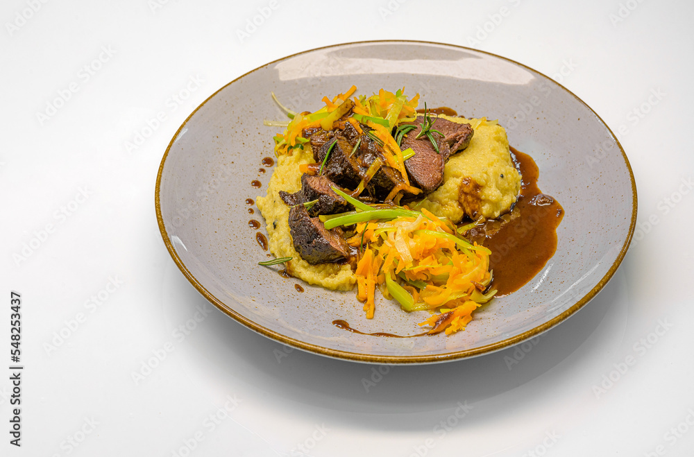 braised beef cheeks with truffle polenta and vegetable strips braised beef cheeks with truffle polenta and vegetable strips