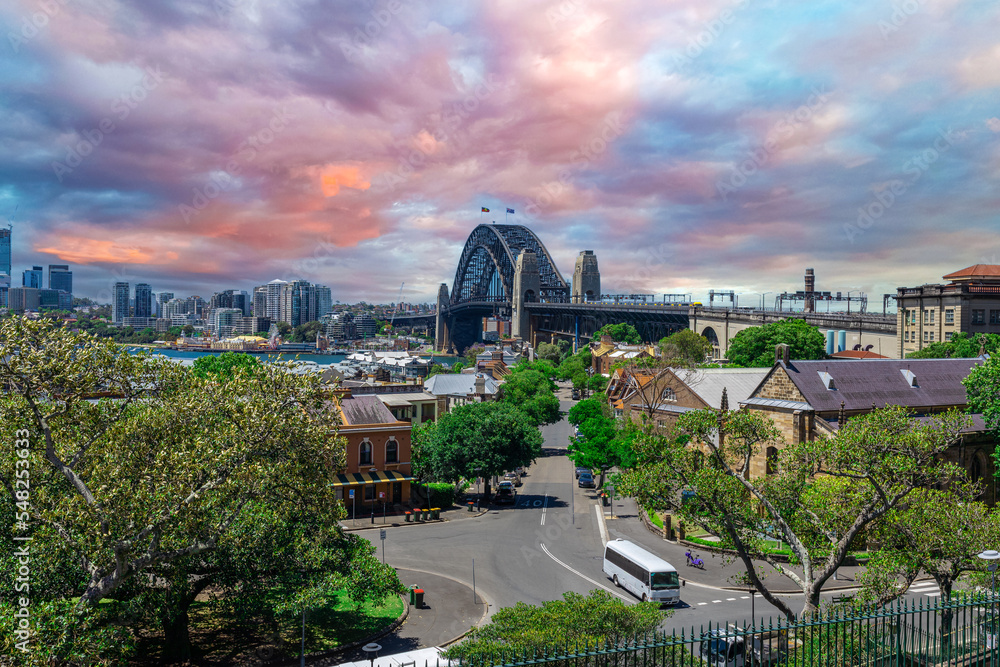 Naklejka premium Sydney Harbour viewed from Observatory Park and overlooking Sydney Rocks area and North Sydney with colourful skies NSW Australia