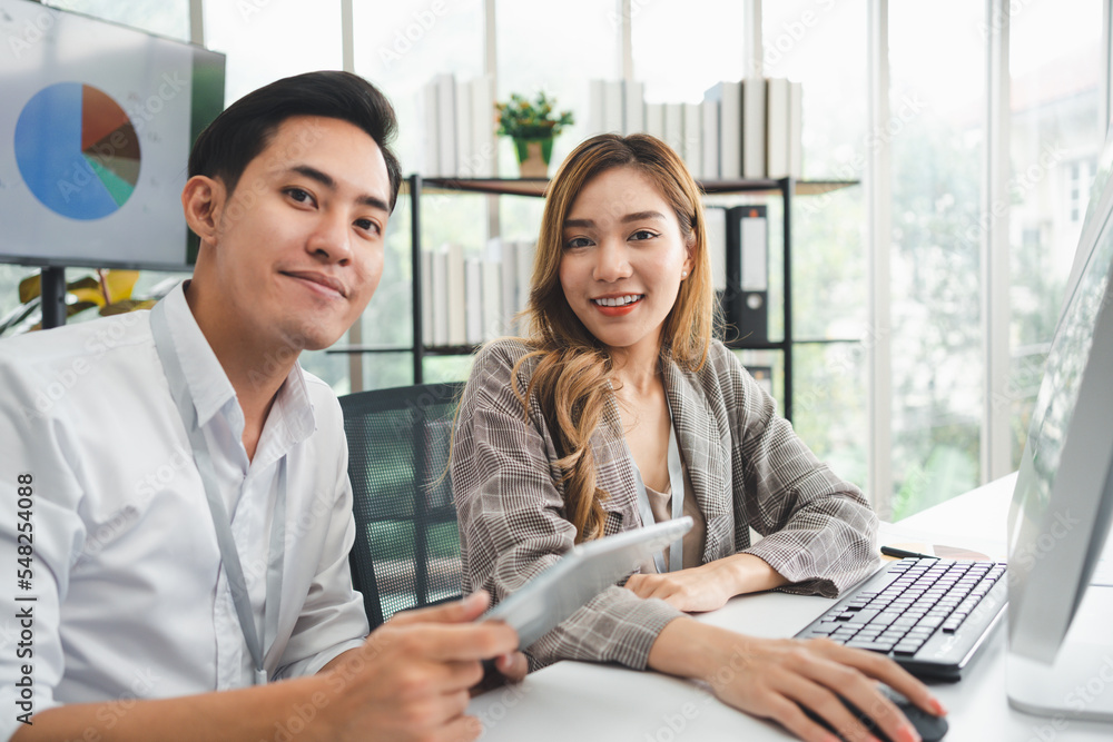 Successful team of new business startup people working together in creative office, happy euphoric proud Asian male and female professional winner feel overjoyed Successful team of new business startup people working together in creative office, happy euphoric proud Asian male and female professional winner feel overjoyed