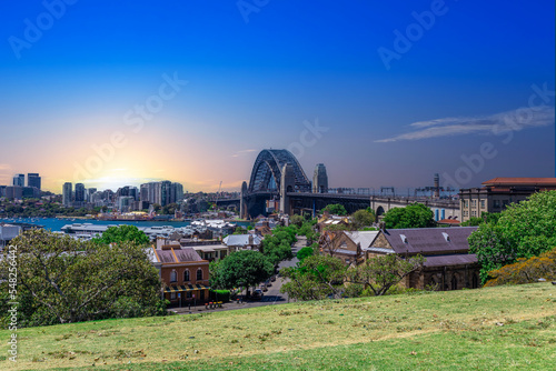 Sydney Harbour viewed from Observatory Park and overlooking Sydney Rocks area and North Sydney with colourful skies NSW Australia