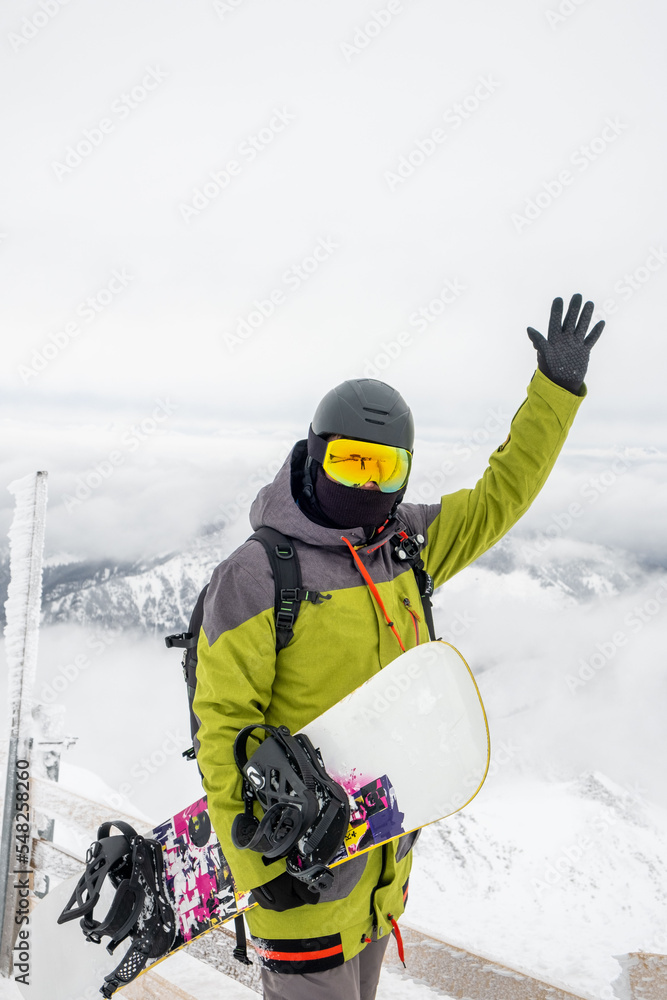 man snowboarder on the top of the chopok mountain