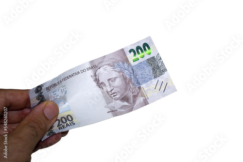 Hand holding a brazilian money two hundred real bill	Transparent background
