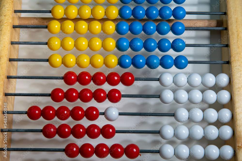 old abacus with blue yellow white an red balls old abacus with blue yellow white an red balls